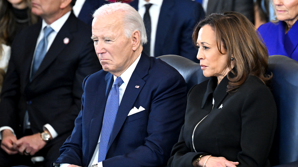 Then-President Joe Biden and then-Vice President Kamala Harris seated in the U.S. Capitol Rotunda
