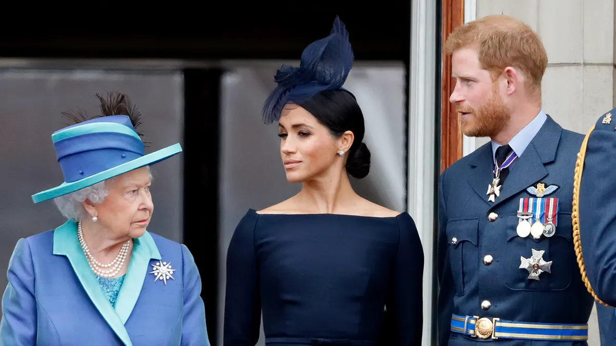 Queen Elizabeth II Meghan Duchess of Sussex and Prince Harry Duke of Sussex watching flypast from Buckingham Palace balcony