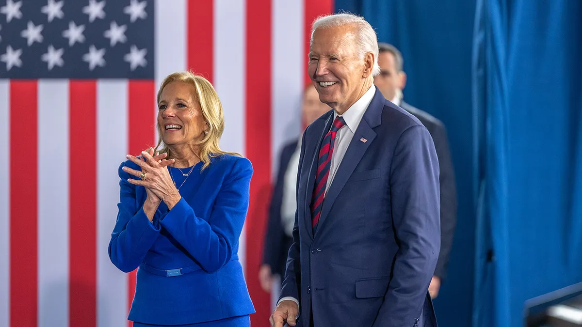 President Joe Biden and first lady Jill Biden exiting stage at International African-American Museum