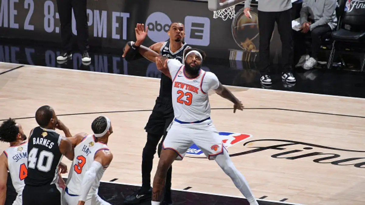 New York Knicks center Mitchell Robinson battles for rebound against Spurs star Victor Wembanyama during Game 1 of the 2026 NBA Finals. (Photo by Michael Gonzales/NBAE via Getty Images)