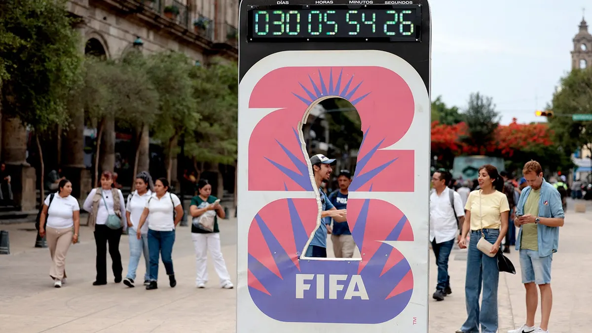 A clock marking 30 days to the 2026 FIFA World Cup in Guadalajara, Mexico with people walking nearby