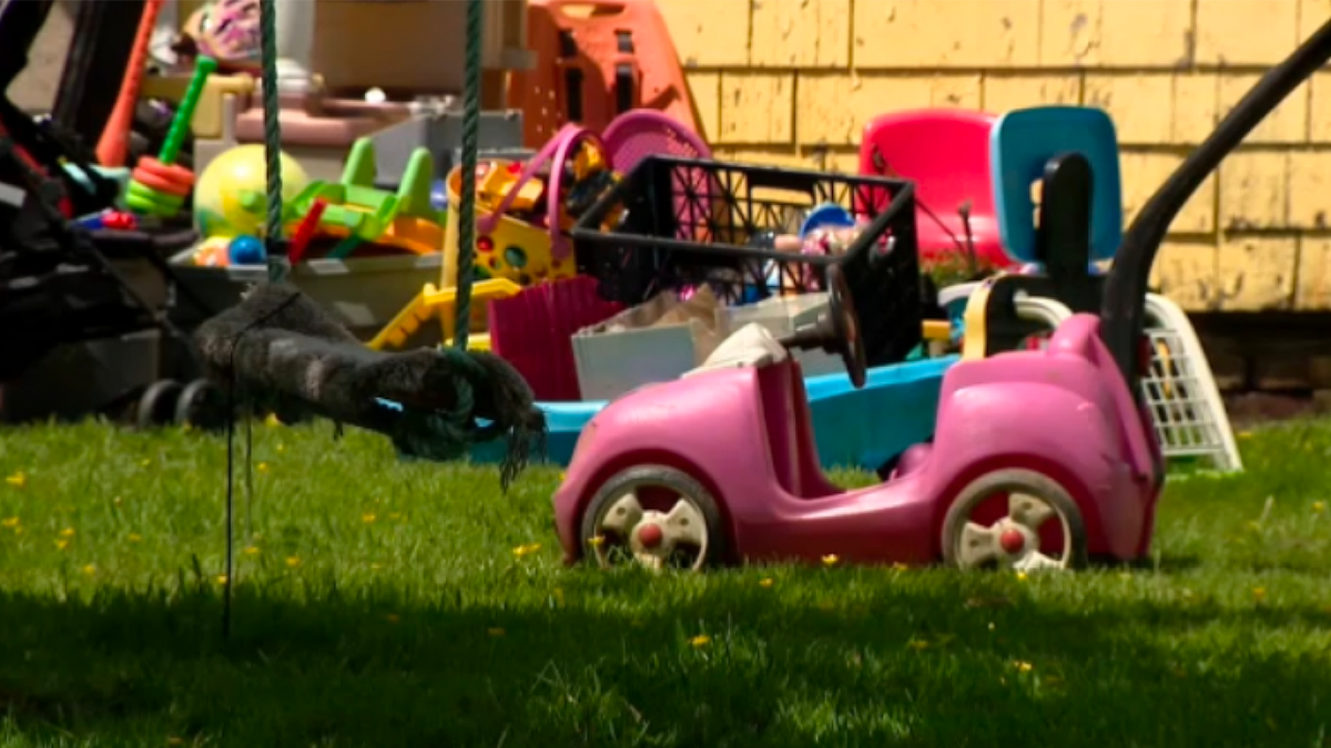 Children's toys were seen in a backyard near the scene.