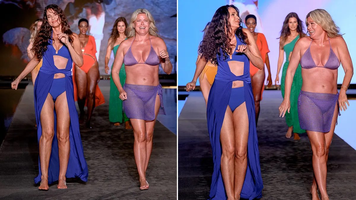 Carol Alt wearing a blue swimsuit walking on a runway.