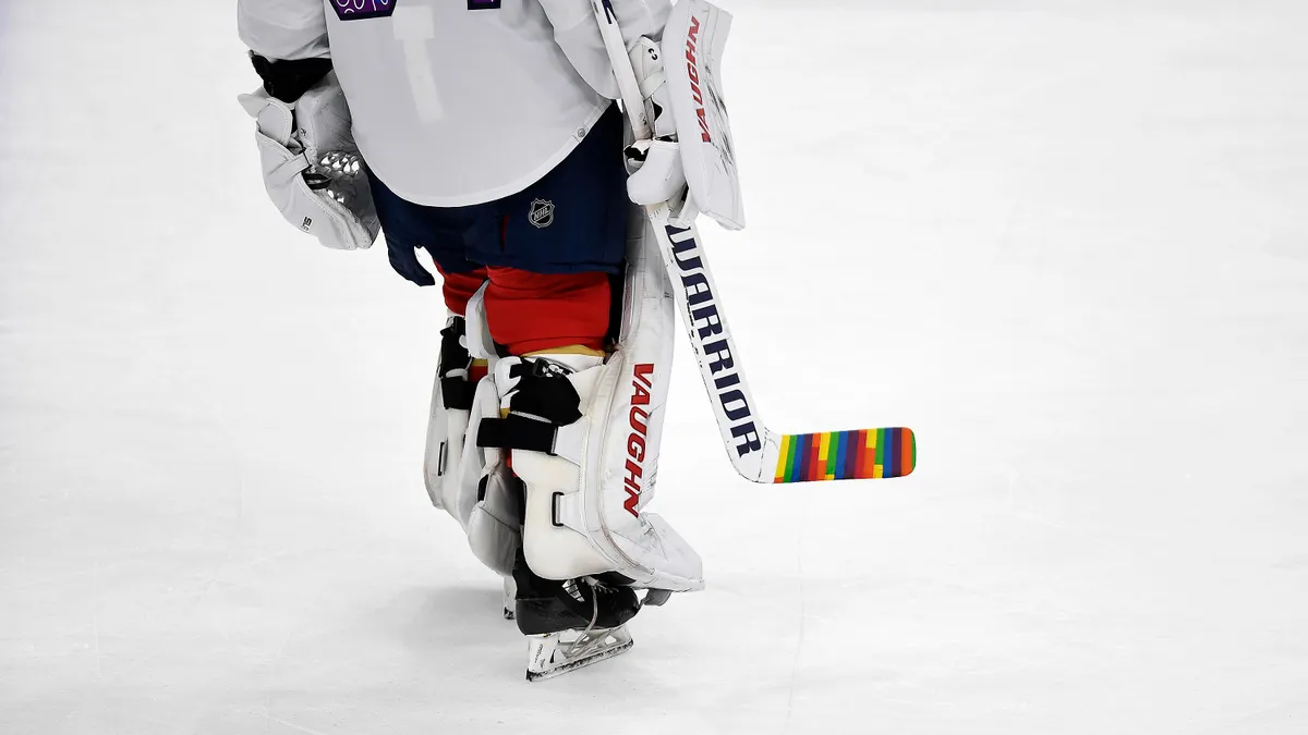 Florida Panthers goaltender Alex Lyon warming up with a colorful hockey stick