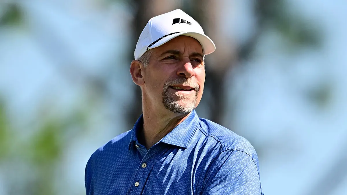 John Smoltz watches his golf shot from the eighth tee at Lake Nona Golf and Country Club