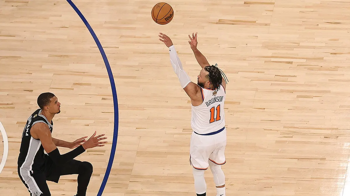 Jalen Brunson shooting a three-point basket over Victor Wembanyama at Madison Square Garden