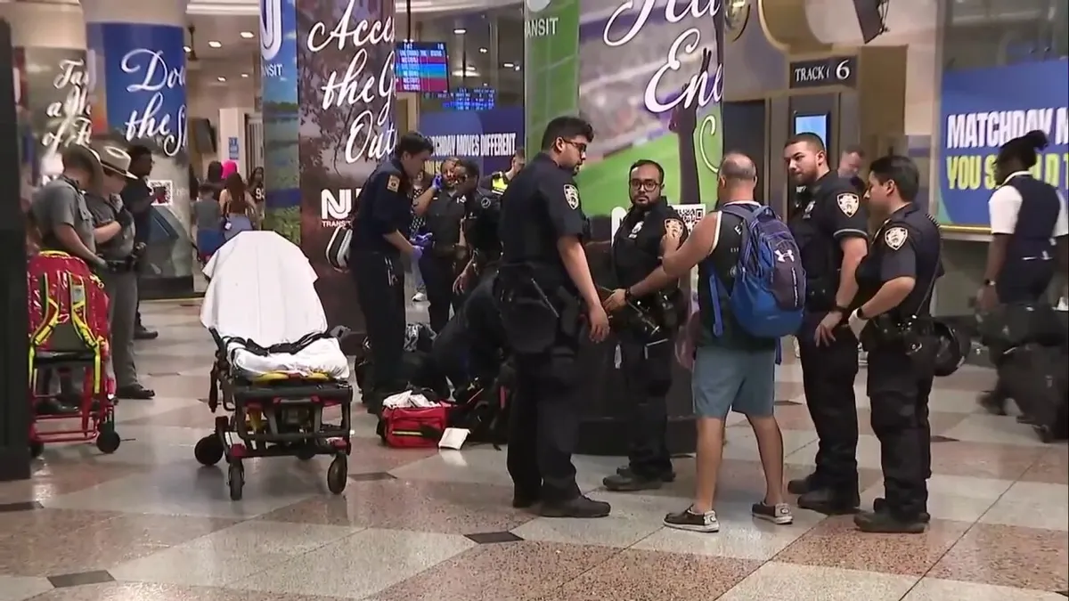 Law enforcement officers and emergency personnel responding inside Penn Station