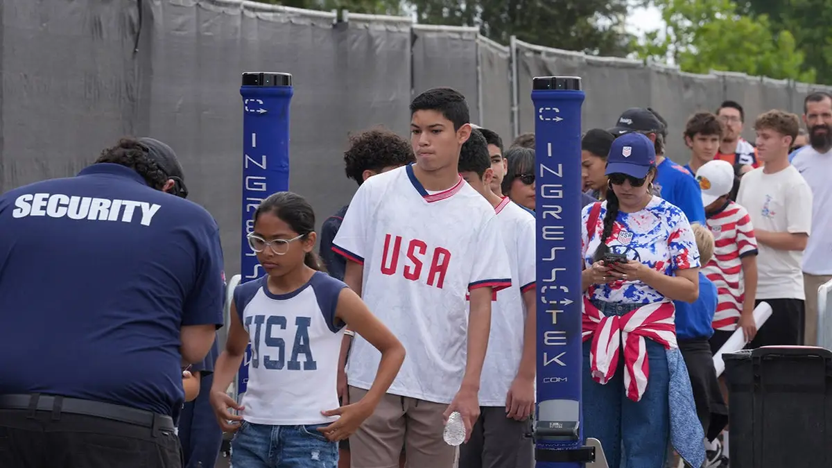 United States fans passing through security checks at training venue in Irvine, California