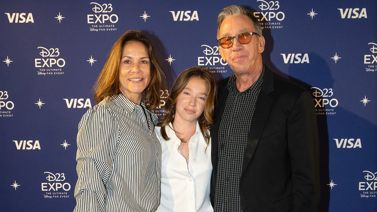 Tim Allen standing with Jane Hajduk and Elizabeth Allen-Dick in a family setting