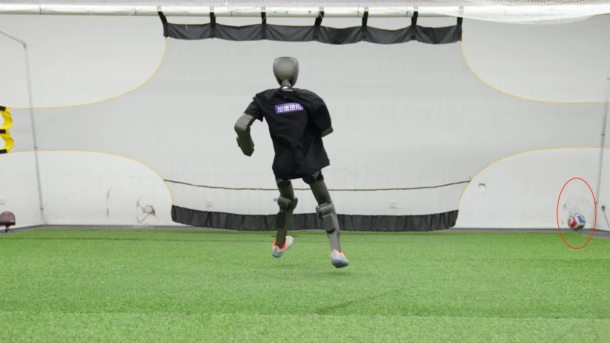 A robot kicking a soccer ball