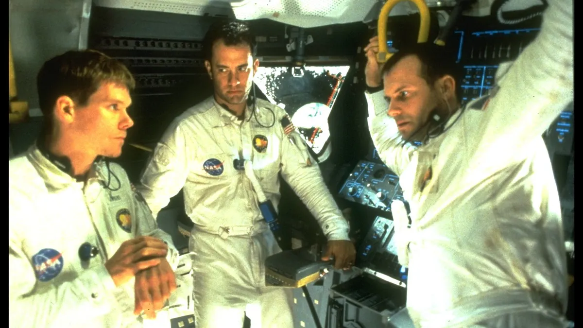 Tom Hanks Kevin Bacon and Bill Paxton standing together in Apollo 13 film scene