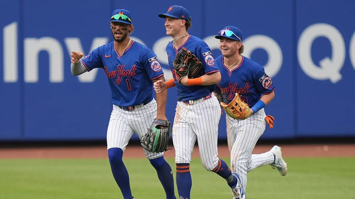 New York Mets outfielders Mj Melendez, Carson Benge, and A.J. Ewing celebrating on field