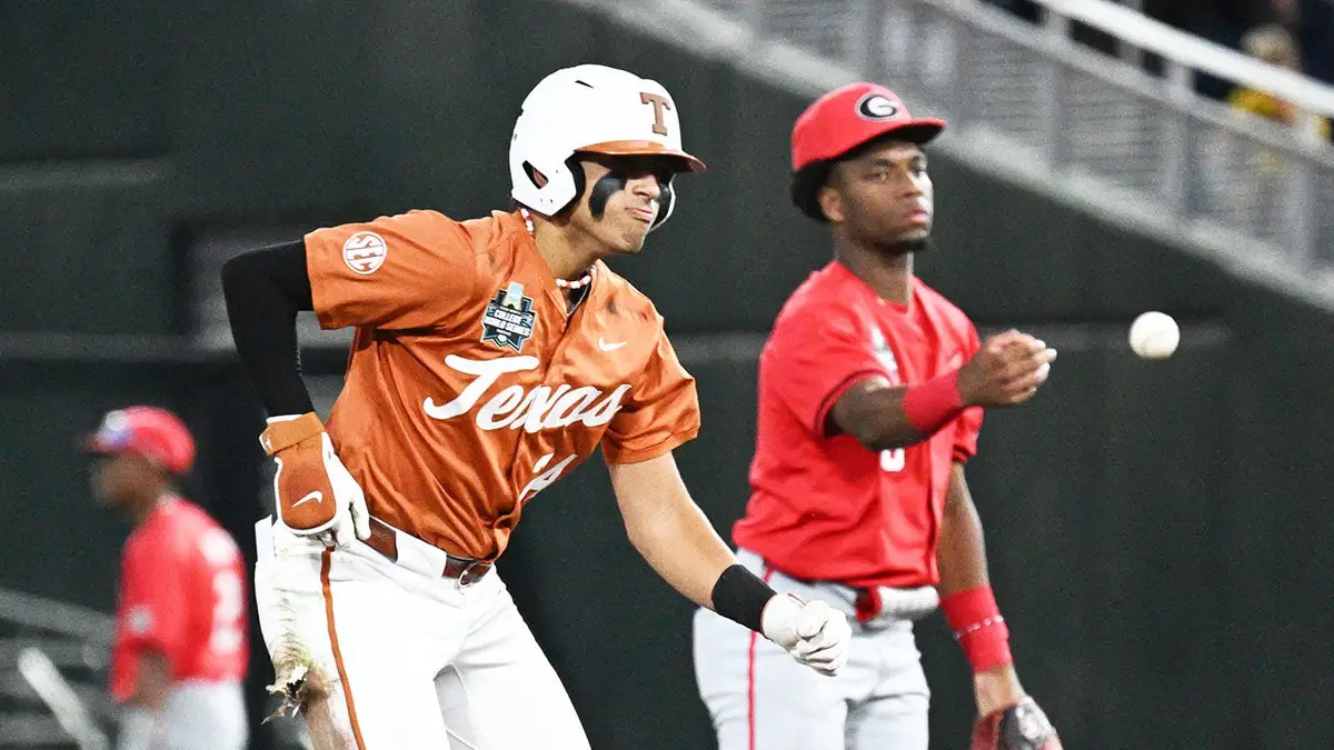 Texas Longhorns shortstop Adrian Rodriguez sliding into second base as Jayden Duplantier flips the ball at Charles Schwab Field