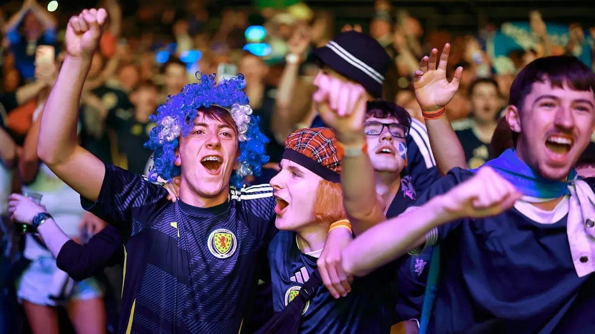 The Tartan Army cheers on the Scottish soccer team during a game.
