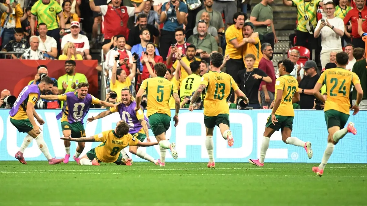 Australia's Connor Metcalfe celebrates with teammates after scoring their second goal against Turkey in the 2026 FIFA World Cup.