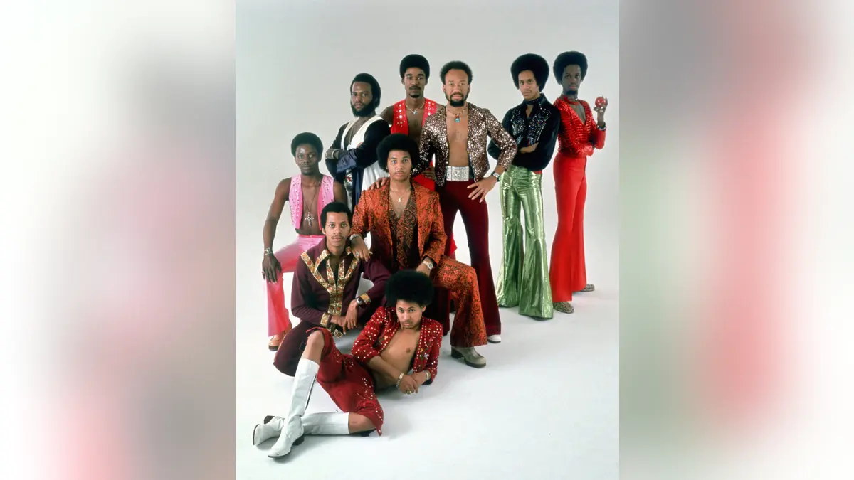 Earth Wind & Fire posing for a studio portrait.