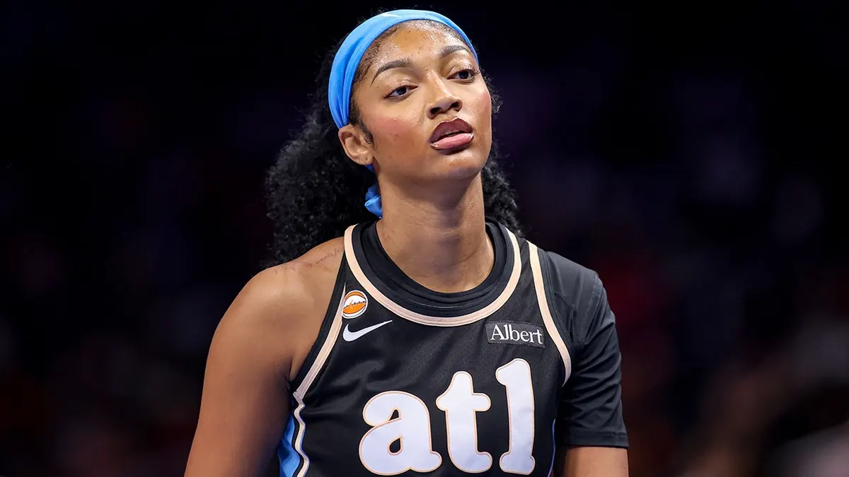 Angel Reese wearing number 5 jersey walking off court at State Farm Arena