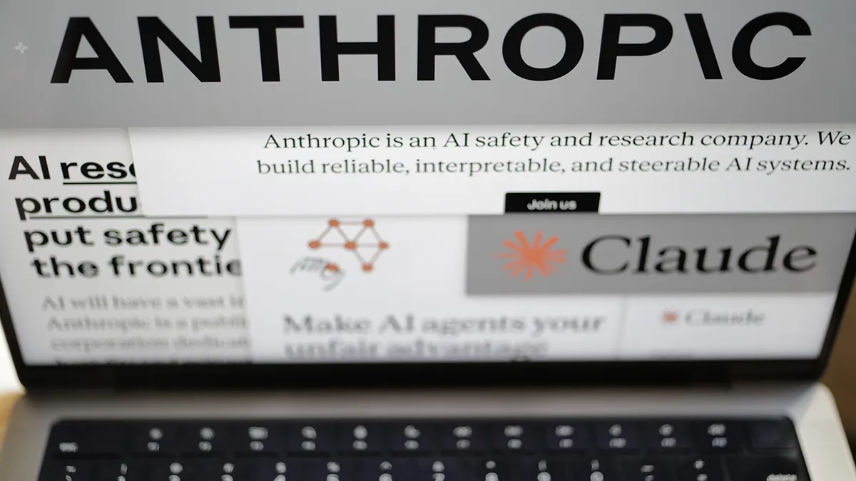 Computer screen displaying Anthropic website pages and company logos