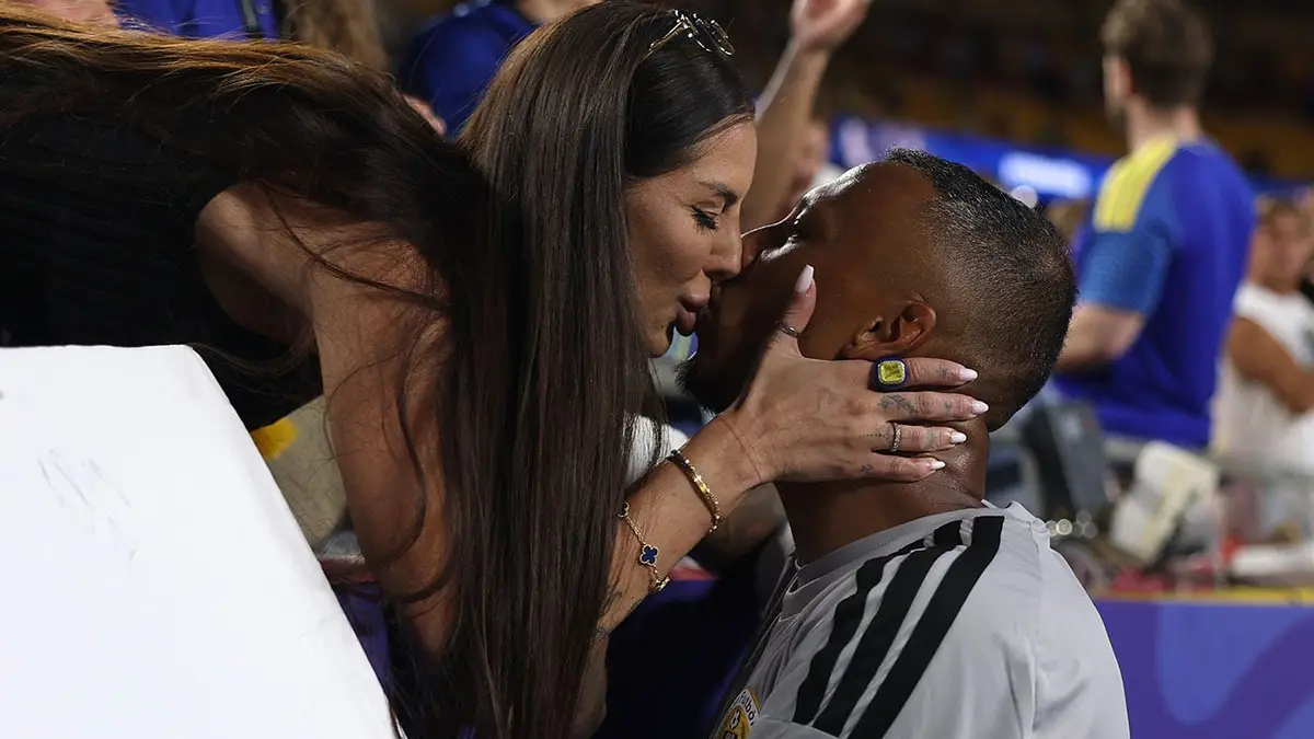 Eloy Room kisses his wife Zorannah at Kansas City Stadium.