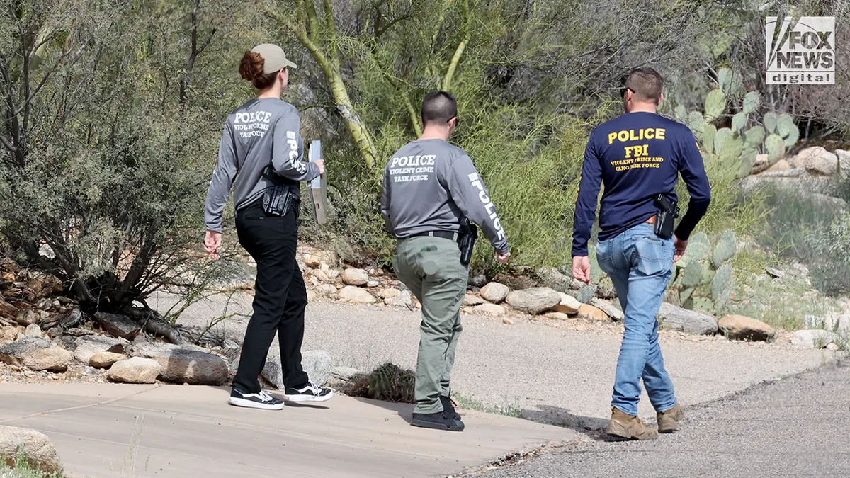 FBI agents and law enforcement officers walking door to door in Nancy Guthrie's neighborhood in Tucson, Arizona.