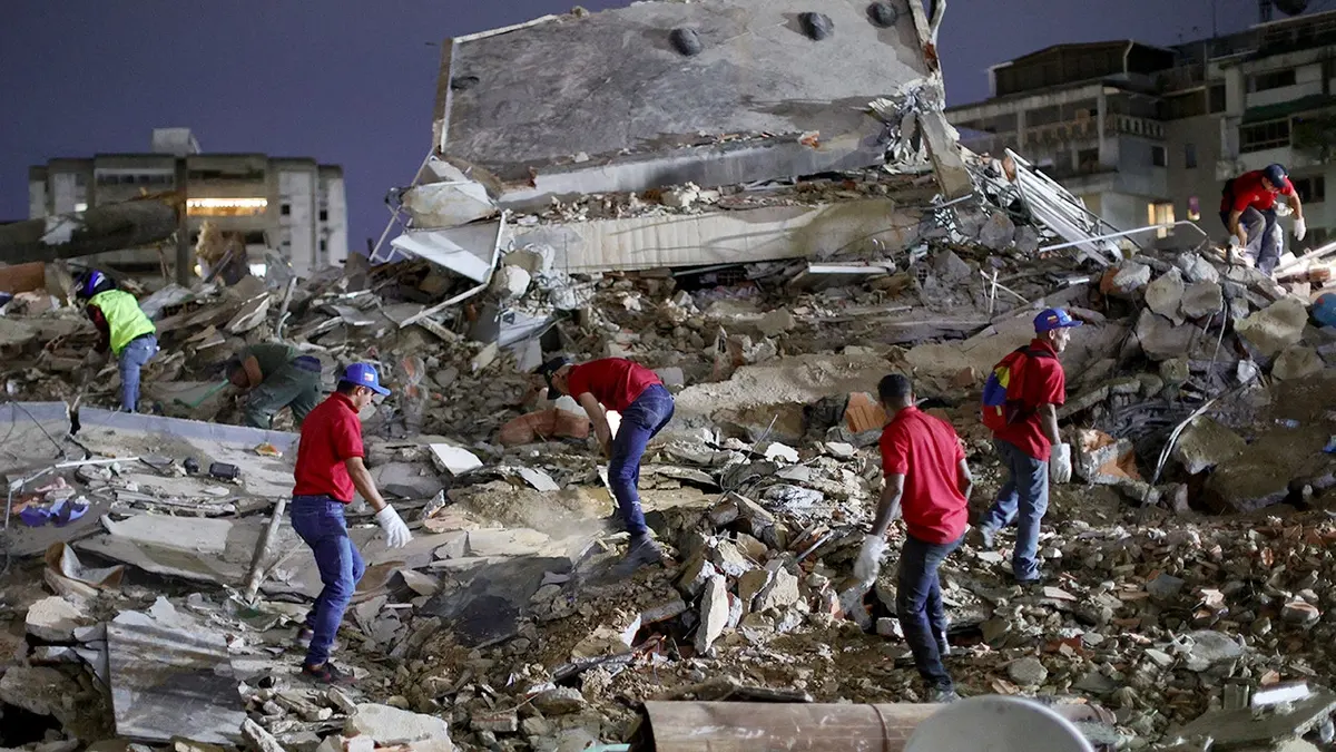 Responders searching for victims in a demolished building in Caracas, Venezuela