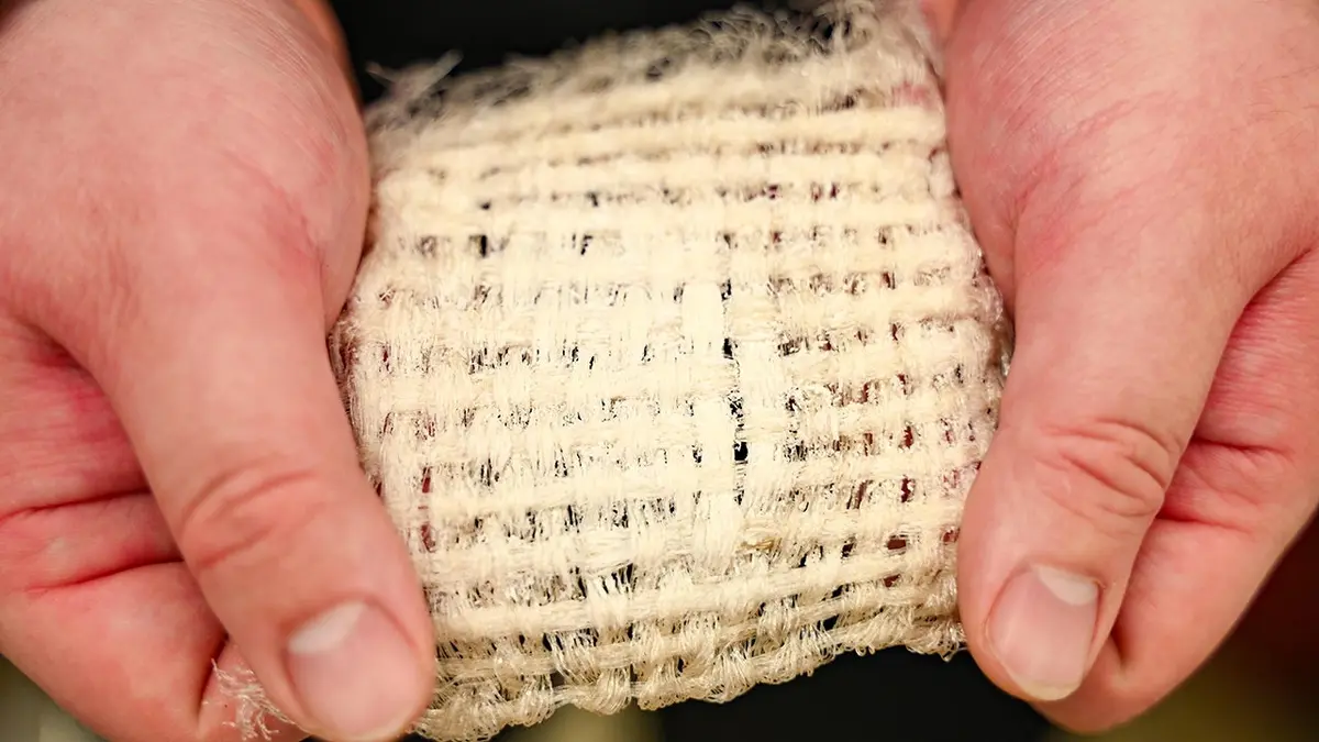 A person holds a swath of high-tech fabric.