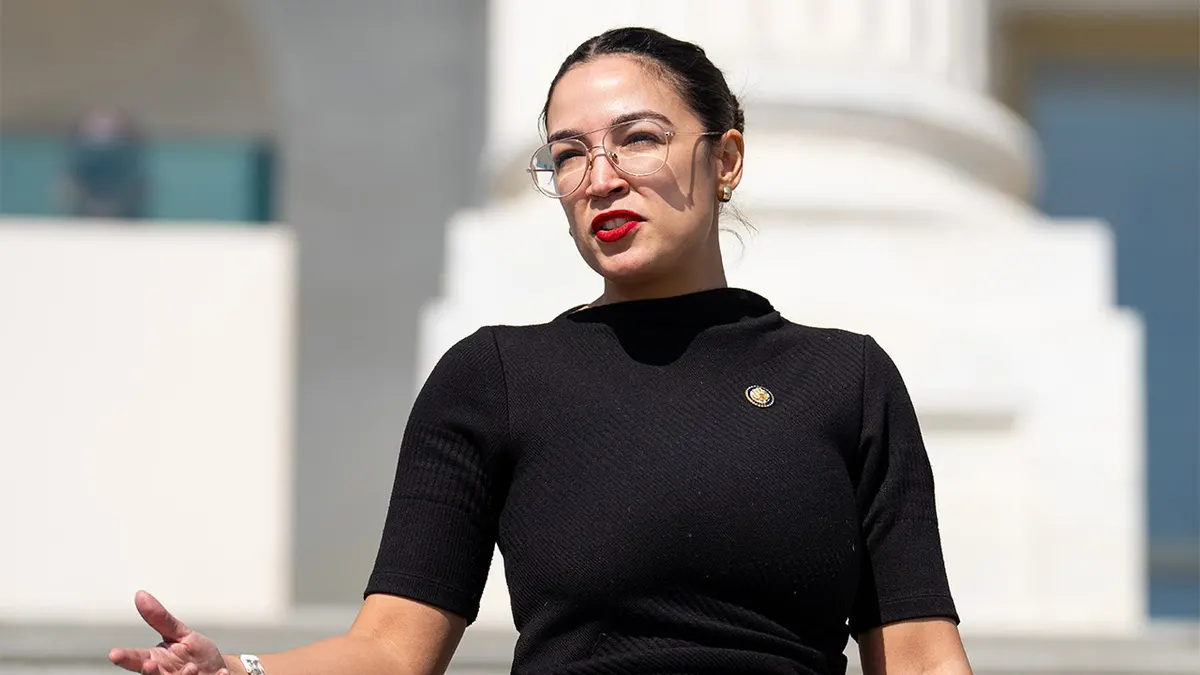 Rep. Alexandria Ocasio-Cortez walking down House steps at U.S. Capitol
