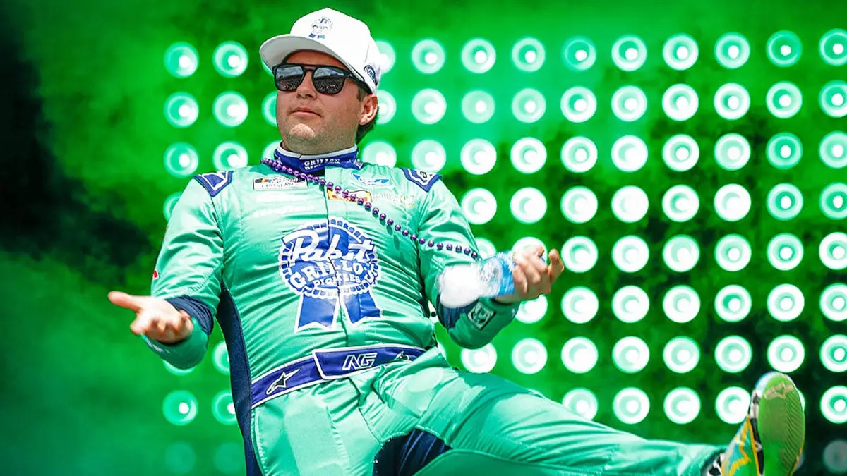 Noah Gragson walking onstage at Talladega Superspeedway during driver introductions.