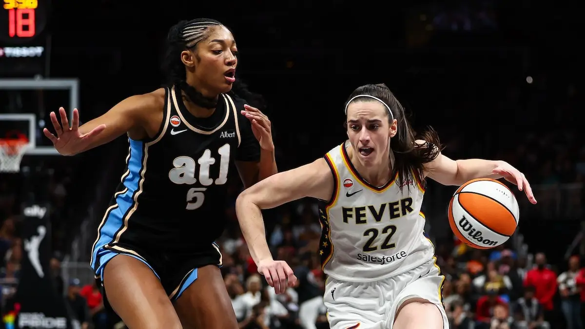Caitlin Clark driving to the basket against Angel Reese at State Farm Arena in Atlanta