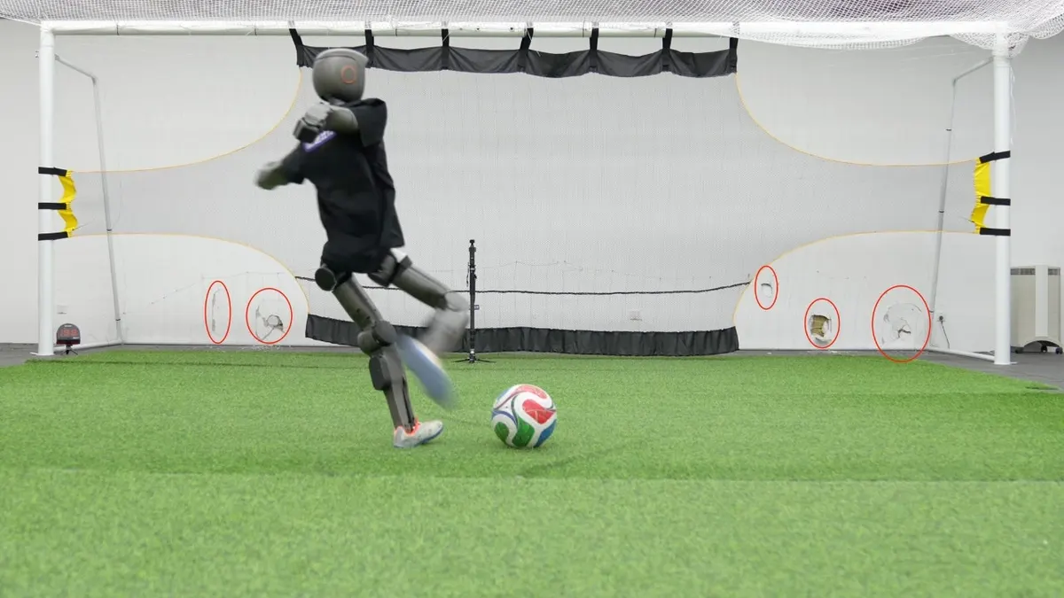 A robot kicking a soccer ball