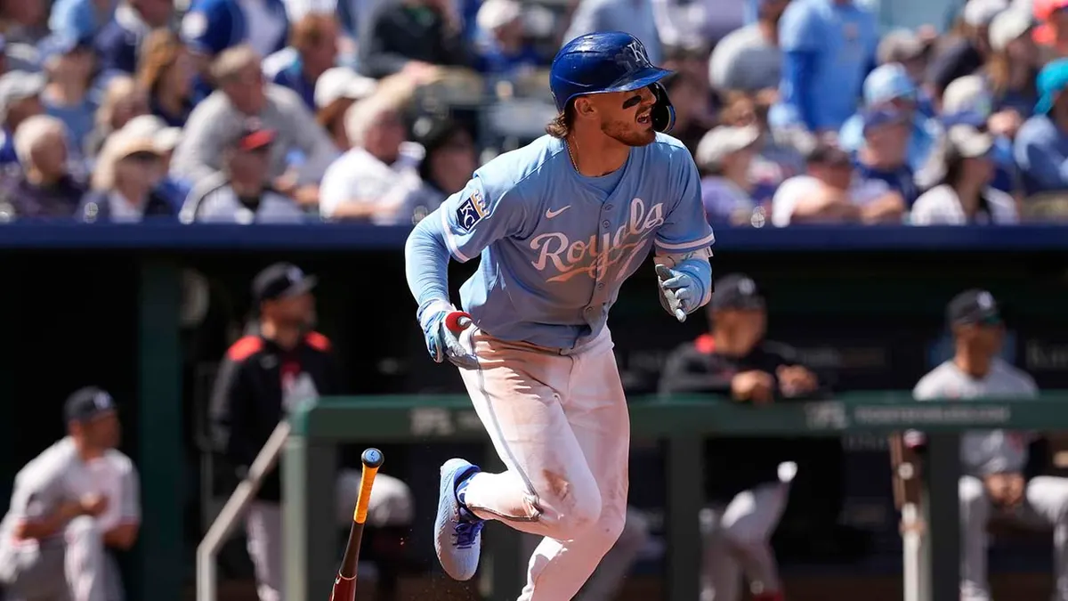 Kansas City Royals' Bobby Witt Jr. watching a sacrifice fly during a baseball game.