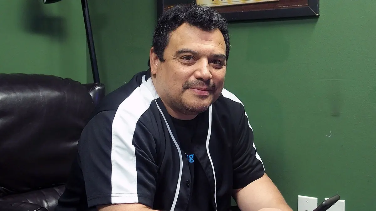 Comedian Carlos Mencia standing backstage at The Stress Factory Comedy Club in New Brunswick, New Jersey.