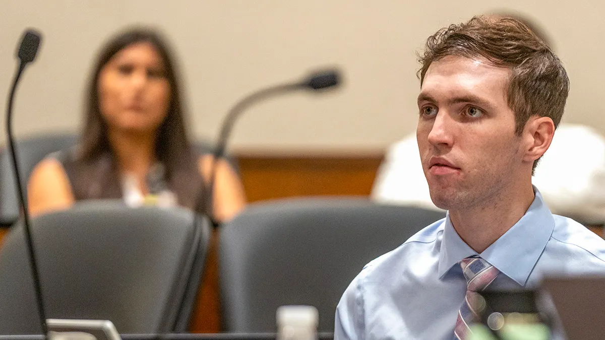 Tyler Robinson standing in a courtroom in Provo, Utah