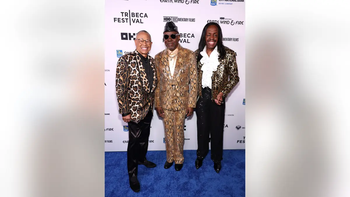 Ralph Johnson, Philip Bailey, and Verdine White standing together at the Beacon Theatre in New York City.