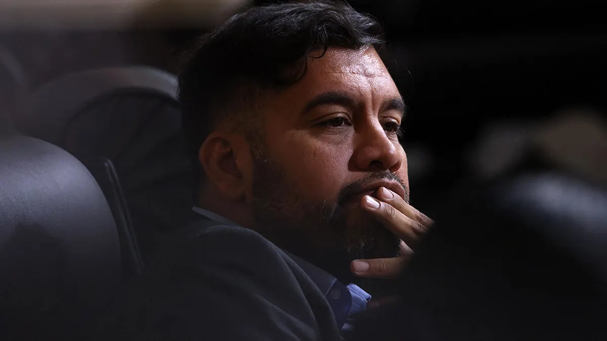 Los Angeles City Council Member Hugo Soto-Martinez watching proceedings inside council chambers at City Hall