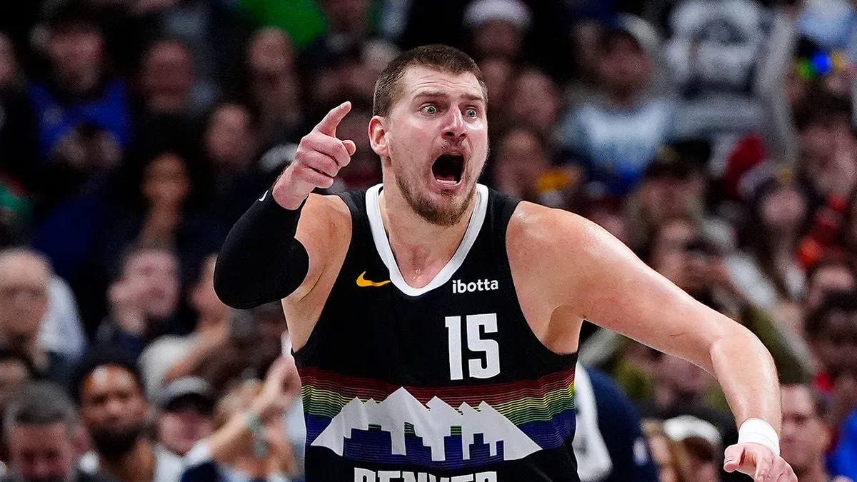 Nikola Jokic reacting during overtime at Ball Arena in Denver