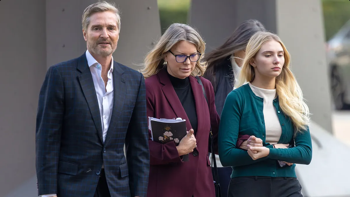 Rebecca Grossman walking with her husband Dr. Peter Grossman and daughter outside Van Nuys Courthouse