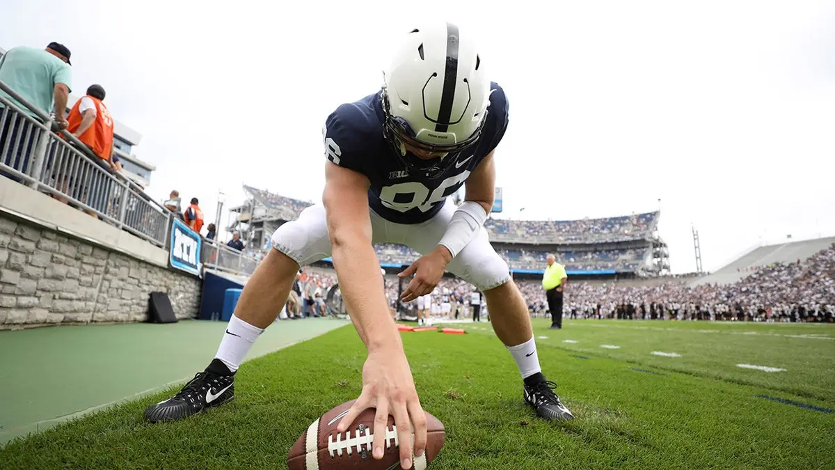 Penn State player Kyle Vasey warming up on sidelines at Beaver Stadium