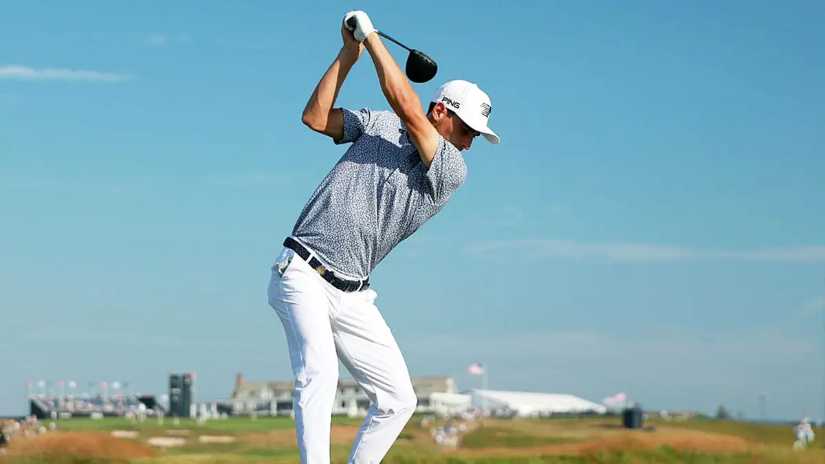 Joaquín Niemann playing a golf shot from the 18th tee at Shinnecock Hills Golf Club