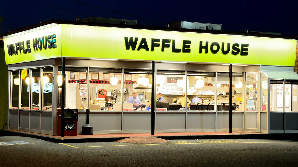 The exterior of a Waffle House diner at night in Athens, Georgia