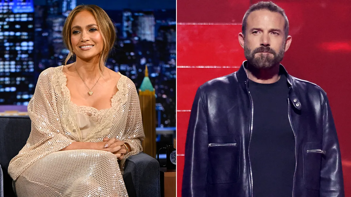 Jennifer Lopez smiling and looking away from the camera.
