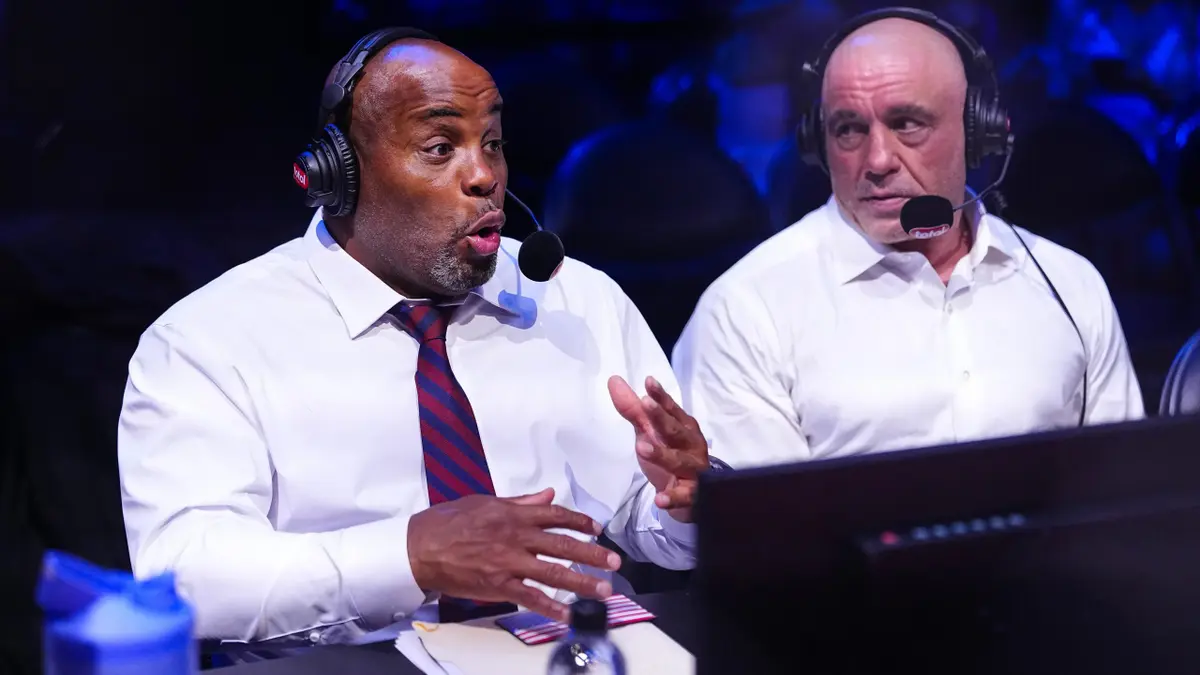 Daniel Cormier and Joe Rogan standing on the South Lawn at the White House announcing fights