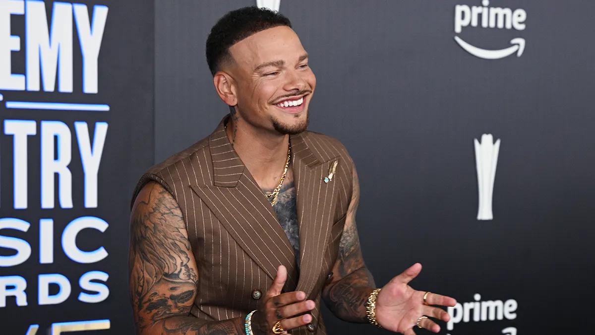 Kane Brown standing on the red carpet at the 61st Academy of Country Music Awards in Las Vegas