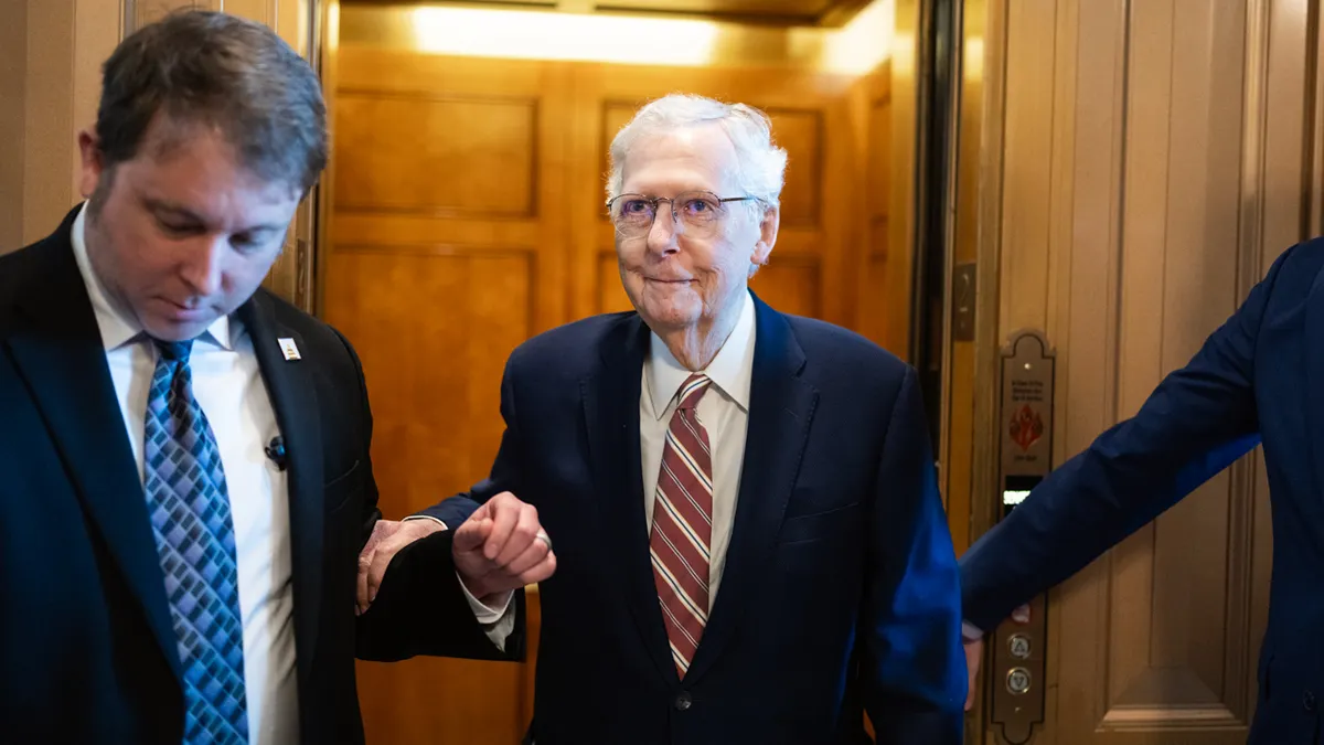 Sen. Mitch McConnell standing in the U.S. Capitol during a Senate vote