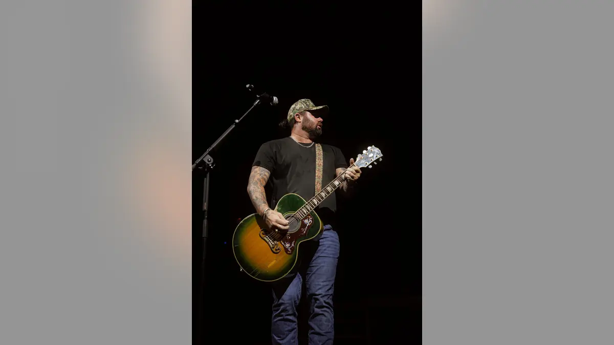 Koe Wetzel singing on stage at Moody Amphitheater during SXSW in Austin, Texas
