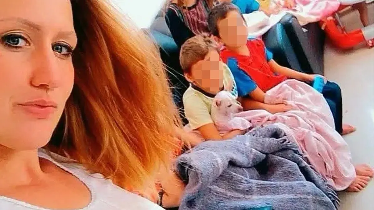 Makala Pendley taking a selfie with two children in the background