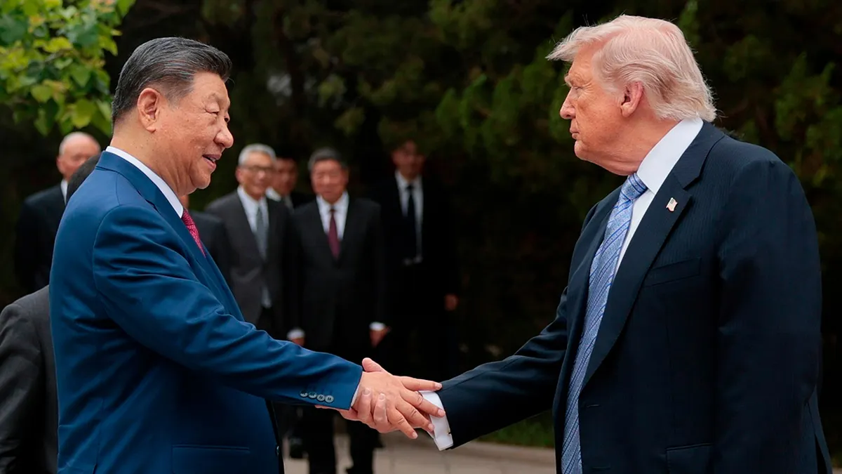 President Donald Trump and shakes hands with Xi Jinping