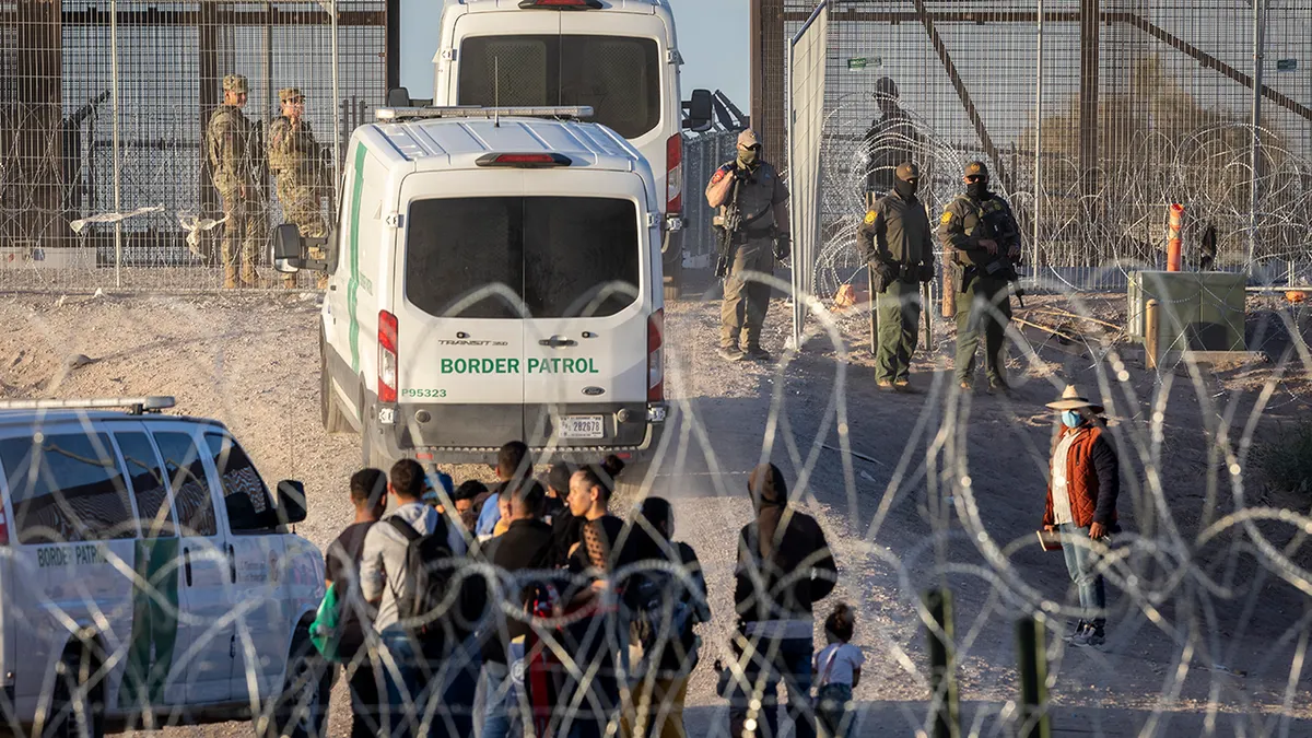 U.S. Border Patrol vehicles transporting groups of immigrants in El Paso Texas