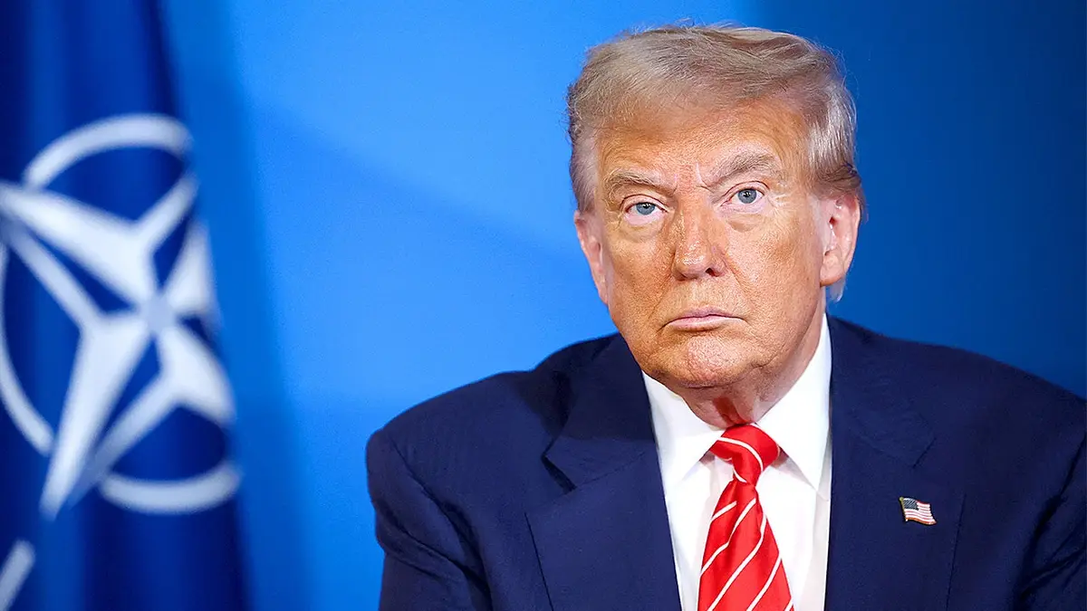 President Donald Trump looks on during NATO summit appearance.