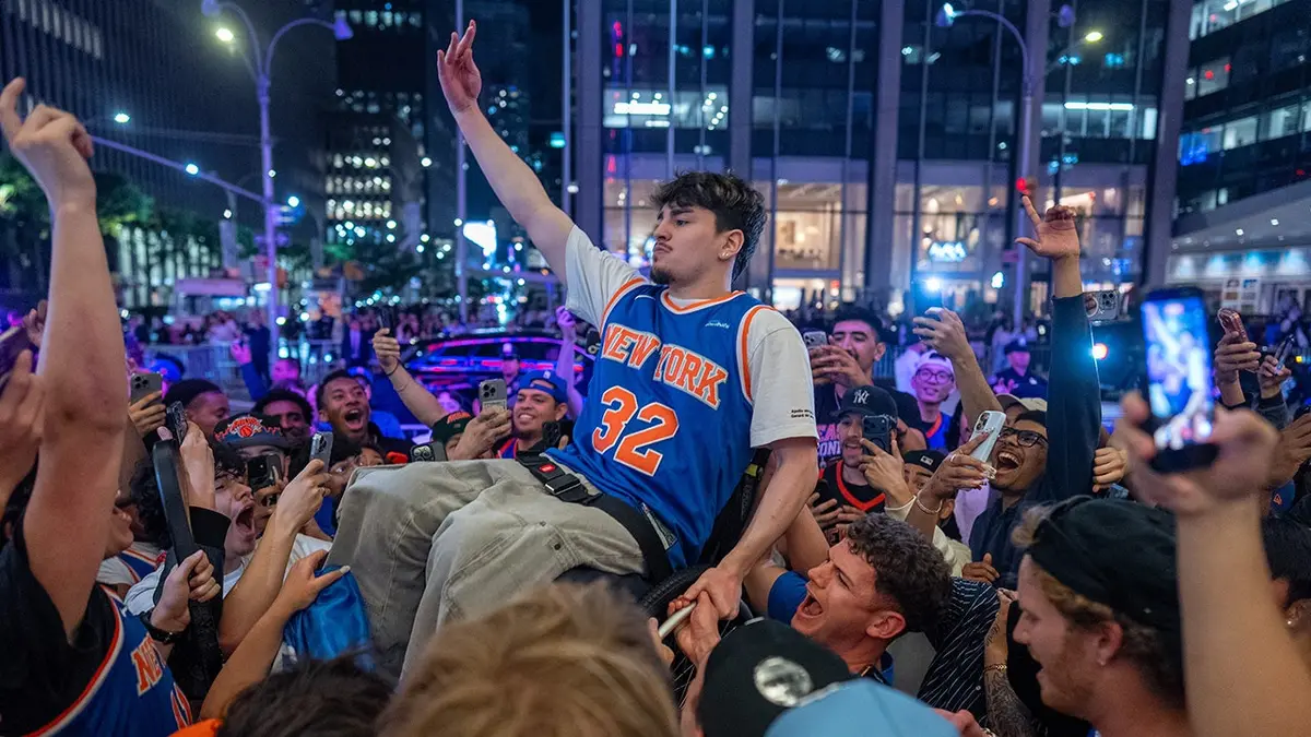 Knicks fans celebrating in New York City after winning eastern conference championship